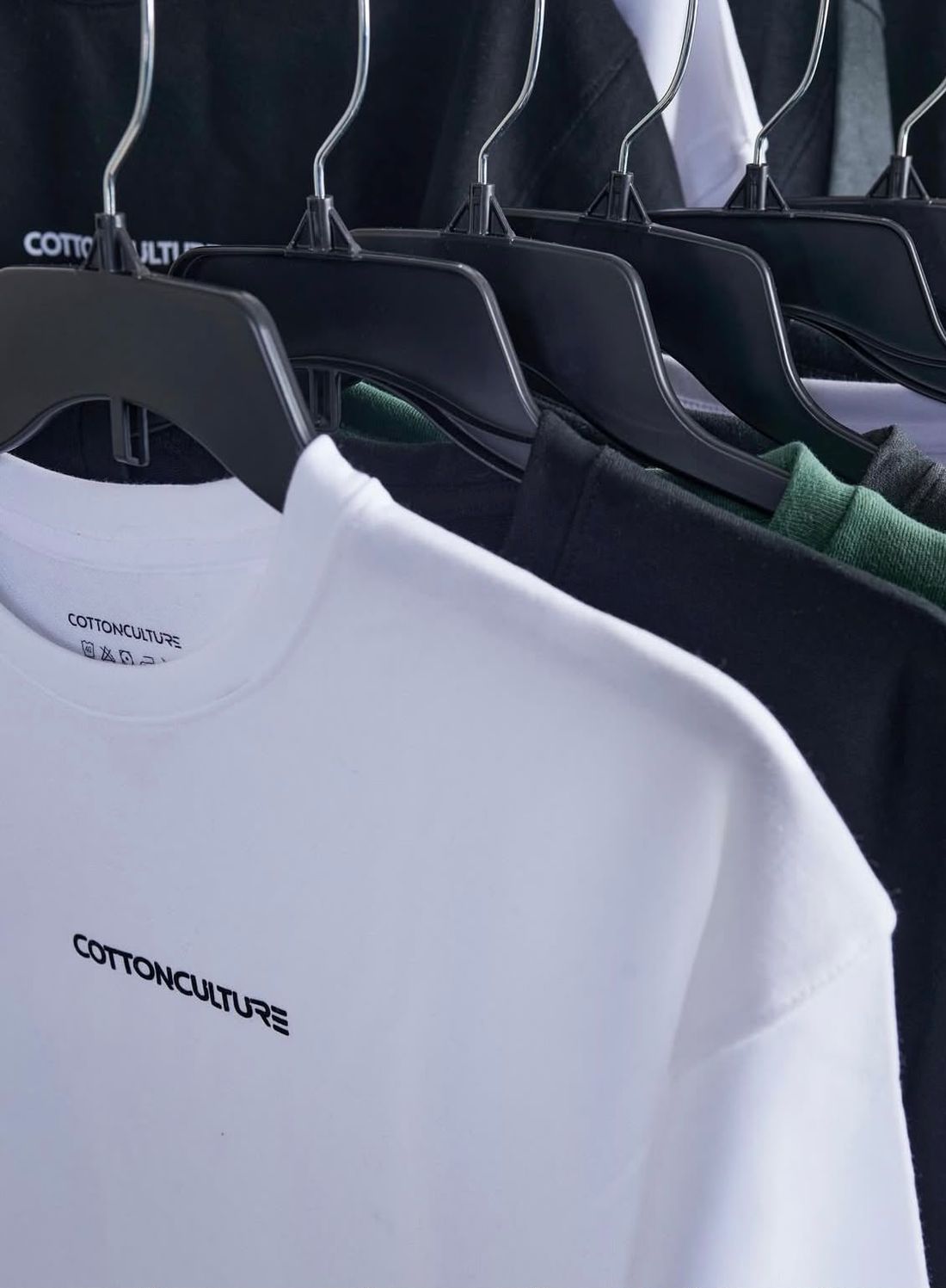 White Signature Tee on a hanger